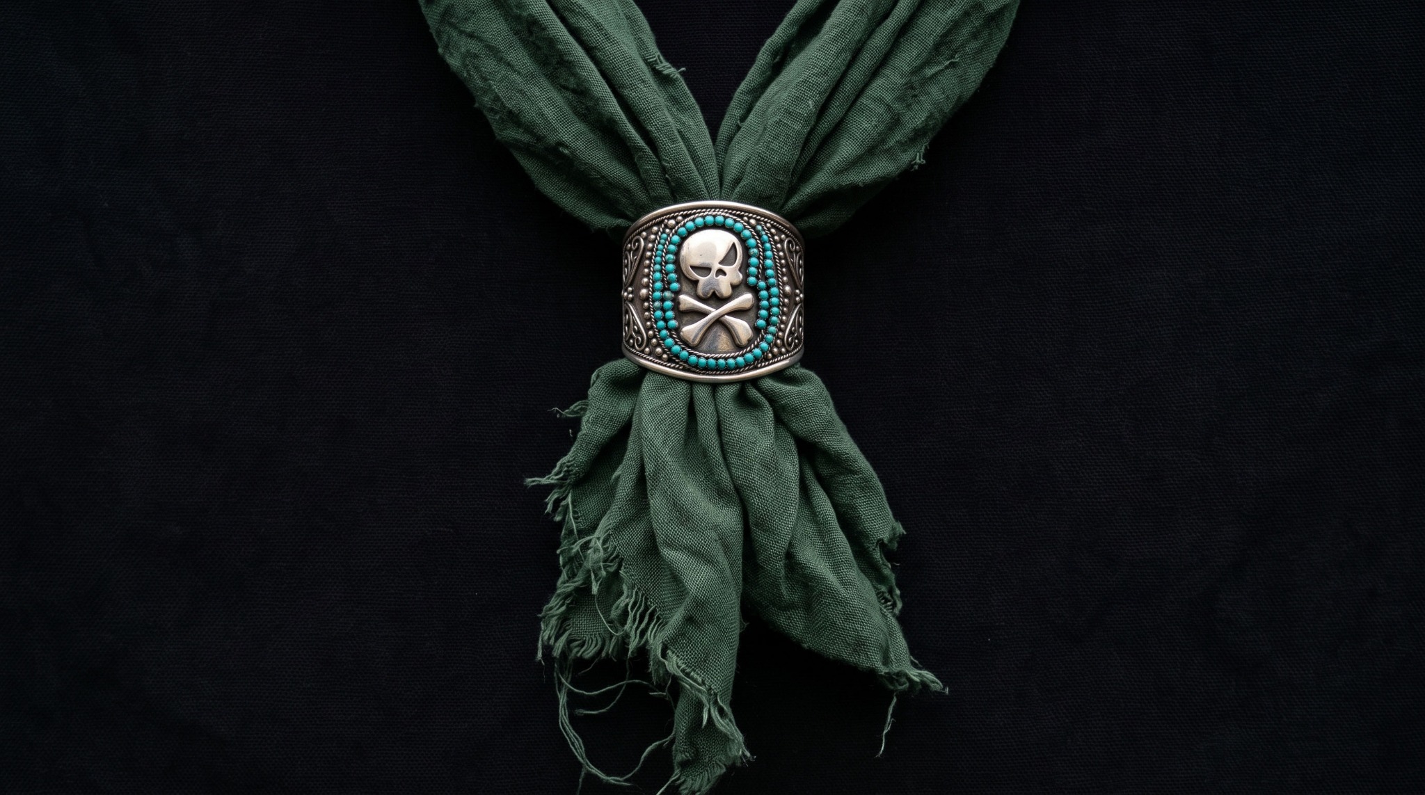 SKULLBY skull motif on a decorated clasp and forest-green scarf