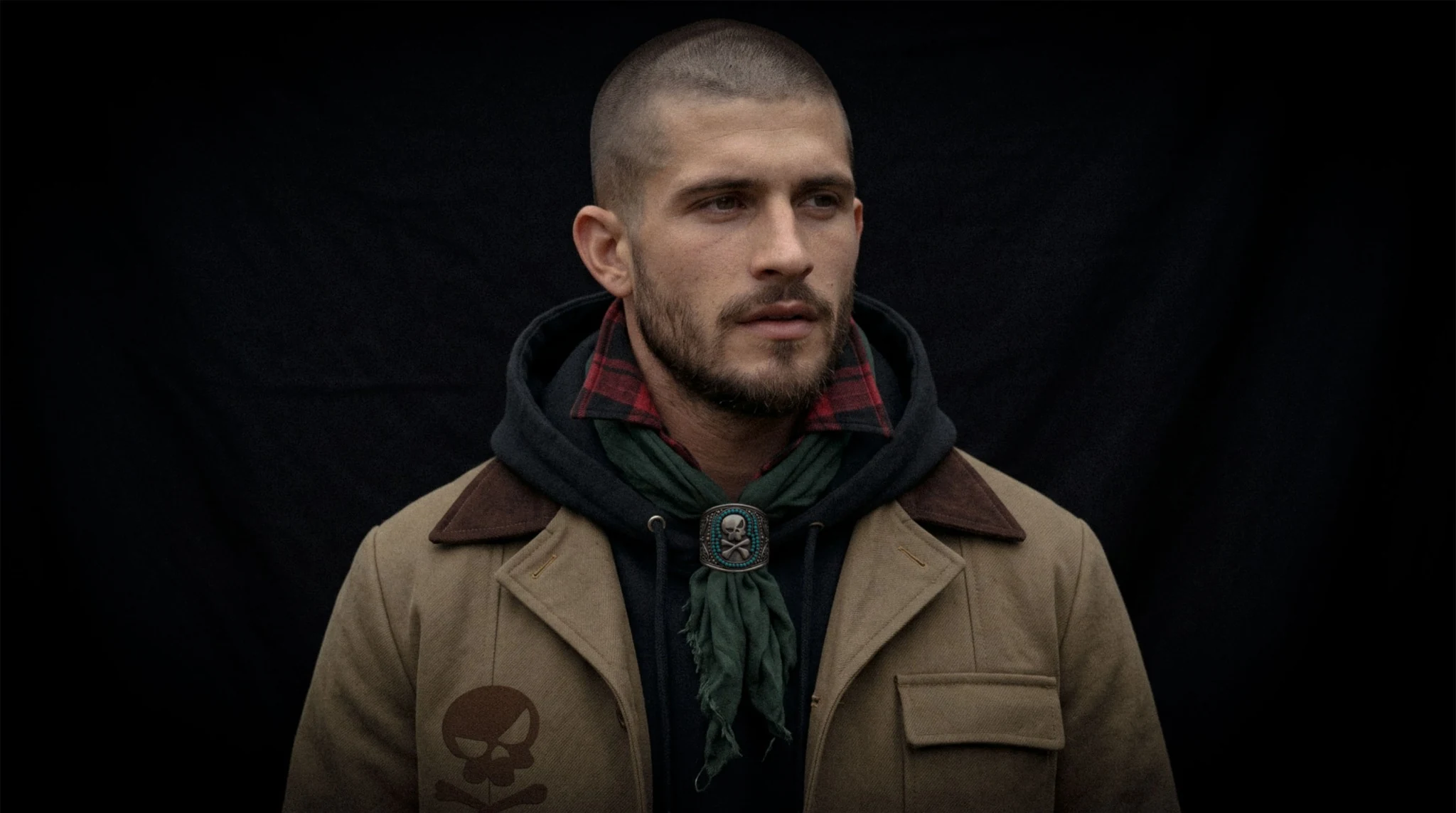 SKULLBY model in dark olive jacket and scarf against a black backdrop